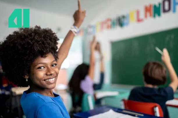 Students in class. raising her hands up.