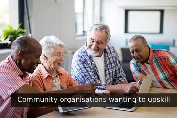 AI FireLabs CIC Learning. Community of senior members looking at the computer