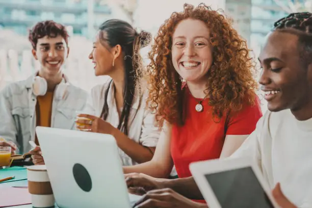 AI Firelabs CIC Learning Programs. Young adults learning with computers